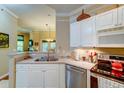 Spacious kitchen with modern appliances and a view to the bright and airy living room at 1832 Telfair Way # 1832, Charleston, SC 29412