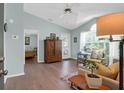 Bright living room with high ceilings, a decorative cabinet, and a cozy seating area at 2011 N Highway 17 # 1400T, Mount Pleasant, SC 29466