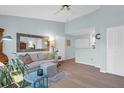 Inviting living room featuring a comfortable sofa, stylish mirror, and hardwood floors at 2011 N Highway 17 # 1400T, Mount Pleasant, SC 29466