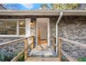 Charming front entrance featuring a brick facade, accessible ramp, and inviting open doorway at 298 Summerset Ln, Summerville, SC 29483
