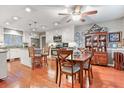 Well-lit kitchen with granite countertops, stainless steel appliances, and a cozy dining area at 302 Summerset Ln, Summerville, SC 29483