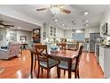 Well-lit kitchen with granite countertops, stainless steel appliances, and a cozy dining area at 302 Summerset Ln, Summerville, SC 29483