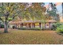 Charming brick ranch-style home with a well-maintained lawn and mature trees at 7 Andrea Ct, Hanahan, SC 29410
