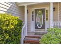 Inviting front entrance with decorative wreath and meticulously maintained landscaping at 715 Majestic Oak Dr, Charleston, SC 29412