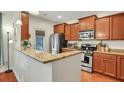 Well-equipped kitchen with granite counters, stainless steel appliances, and ample cabinetry at 853 Bibury Ct, Charleston, SC 29414