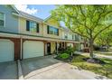 Charming townhome with attached garage, covered porch and lush landscaping at 8652 Grassy Oak Trl, North Charleston, SC 29420