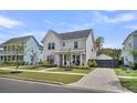 Beautiful two-story home with manicured lawn and a modern farmhouse design at 116 Backhurst Dr, Summerville, SC 29486