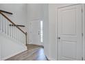 Bright entryway with staircase and wood-look flooring at 124 Sumac Dr, Goose Creek, SC 29445