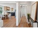 Spacious home interior with hardwood floors, showcasing the kitchen, hallway, and staircase at 1456 Remount Rd, North Charleston, SC 29406