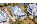 An aerial view showing the home's location, roof, driveway, and neighboring houses at 1604 Bernier Commons, Johns Island, SC 29455