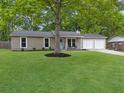 Well-maintained single-story home with lush front lawn and an inviting light blue front door, enhancing curb appeal at 166 Braly Dr, Summerville, SC 29485