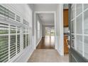Bright foyer with tiled flooring that transitions into hardwood floors, adjacent to a sunlit living area at 170 Sea Lavender Ln, Summerville, SC 29486