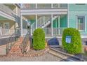 Home exterior featuring a staircase leading to a white balcony at 172 Saint Philip St # F, Charleston, SC 29403