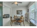 Cozy dining room featuring a modern round table, adjacent to a kitchen with plenty of sunlight at 203 Two Hitch Rd, Goose Creek, SC 29445