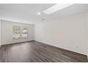 Bright living room featuring modern vinyl floors, neutral paint, and lots of natural light at 205 Lynton Ct, Goose Creek, SC 29445