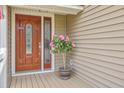 Elegant front door with decorative glass and pink Hibiscus at 2275 Pristine View Rd, Charleston, SC 29414