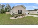 Charming home with manicured lawn and stone accents adding a touch of elegance at 313 Squire Pope Rd, Summerville, SC 29486