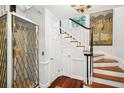 Elegant staircase and foyer area with an elevator for easy access at 39 N Adgers Wharf, Charleston, SC 29401