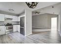 Open kitchen featuring stainless steel appliances and a spacious connected living area at 414 Courtland Dr, Summerville, SC 29486