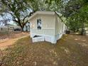 Side exterior view of a single-wide mobile home showing foundation skirting at 5626 Shelton St, North Charleston, SC 29406