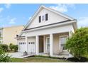 Attractive home featuring a covered porch, well-kept landscaping and large driveway at 589 Crossland Dr, Moncks Corner, SC 29461
