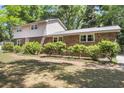 This property features a charming brick exterior, lush landscaping, and a well-maintained lawn at 679 Edmonds Dr, Charleston, SC 29412