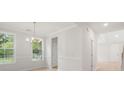 Bright dining room with windows, chair rail detail, crown molding and chandelier at 752 Minton Rd, Charleston, SC 29412