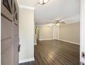 Spacious living area with wood floors, ceiling fan, and built-in shelves at 7935 Edgebrook Cir # 2202, North Charleston, SC 29418