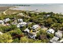 Expansive aerial view of property showcasing its proximity to the serene coastline and surrounding residential area at 930 Richter Way, Mount Pleasant, SC 29464