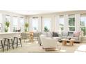 Open-concept living space with ample natural light, dining area, and modern furnishings at 1005 Sagegrass, Summerville, SC 29485