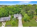 Scenic aerial view of a home nestled amongst lush greenery and showcasing a serene setting at 1061 Reverend Joseph Heyward Rd, Charleston, SC 29414