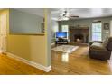Cozy living room with hardwood floors, brick fireplace and comfortable seating at 1061 Reverend Joseph Heyward Rd, Charleston, SC 29414