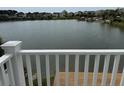 Scenic view of the community lake with dockside deck, captured from an elevated porch at 1144 Clearspring Dr, Charleston, SC 29412