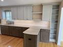 Bright kitchen with updated cabinets, marble counters, and hardwood flooring at 1144 Clearspring Dr, Charleston, SC 29412