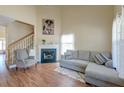 Comfortable living room with fireplace, staircase, and a large sectional sofa at 132 Lynches River Dr, Summerville, SC 29485