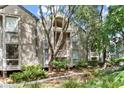 Charming exterior of the building with lush greenery and mature trees at 1332 Pelican Watch Villas, Seabrook Island, SC 29455