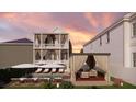 An inviting backyard featuring a pool, lounge chairs, and a covered seating area at 134 Spring St, Charleston, SC 29403
