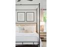 Beautiful main bedroom featuring a four-poster bed, soft lighting, and neutral decor at 14 Paula Dr, Charleston, SC 29407