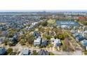 Aerial view of neighborhood with lake, school, and other amenities at 1427 Wando View St, Charleston, SC 29492