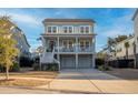 Attractive two-story home with a well-kept lawn, complemented by a welcoming front porch and a convenient driveway at 1464 Stratton Pl, Mount Pleasant, SC 29466