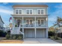 Beautiful two-story home boasting a classic design with a spacious front porch, perfect for relaxing outdoors at 1464 Stratton Pl, Mount Pleasant, SC 29466