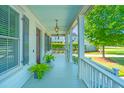 Inviting front porch with charming details and ample space for seating, perfect for relaxing outdoors at 1510 Windlass Way, Mount Pleasant, SC 29466