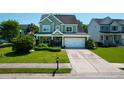 Charming two-story home with a well-manicured lawn and inviting curb appeal at 2009 Terrabrook Ln, Charleston, SC 29412
