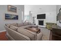 Cozy living room with a fireplace, comfortable seating, and modern decor at 2009 Terrabrook Ln, Charleston, SC 29412