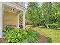 Charming front porch with lush landscaping and view of the walkway at 2096 Promenade Ct, Mount Pleasant, SC 29466