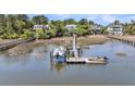 Boats parked at a private dock on the water with neighborhood homes in the background at 2254 Beckenham Dr, Mount Pleasant, SC 29466