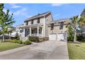 Beautiful home with a spacious driveway, two-car garage, and inviting front porch at 2636 Colonel Harrison Dr, Johns Island, SC 29455