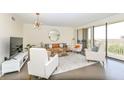 Inviting living room with a leather sofa, sleek decor and expansive views at 330 Concord St # 4A, Charleston, SC 29401