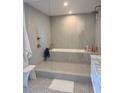 Modern bathroom featuring a glass-enclosed shower and luxurious soaking tub at 330 Concord St # 5D & 5E, Charleston, SC 29401