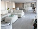 Spacious living room with a comfortable white sectional sofa and open floor plan at 330 Concord St # 5D & 5E, Charleston, SC 29401